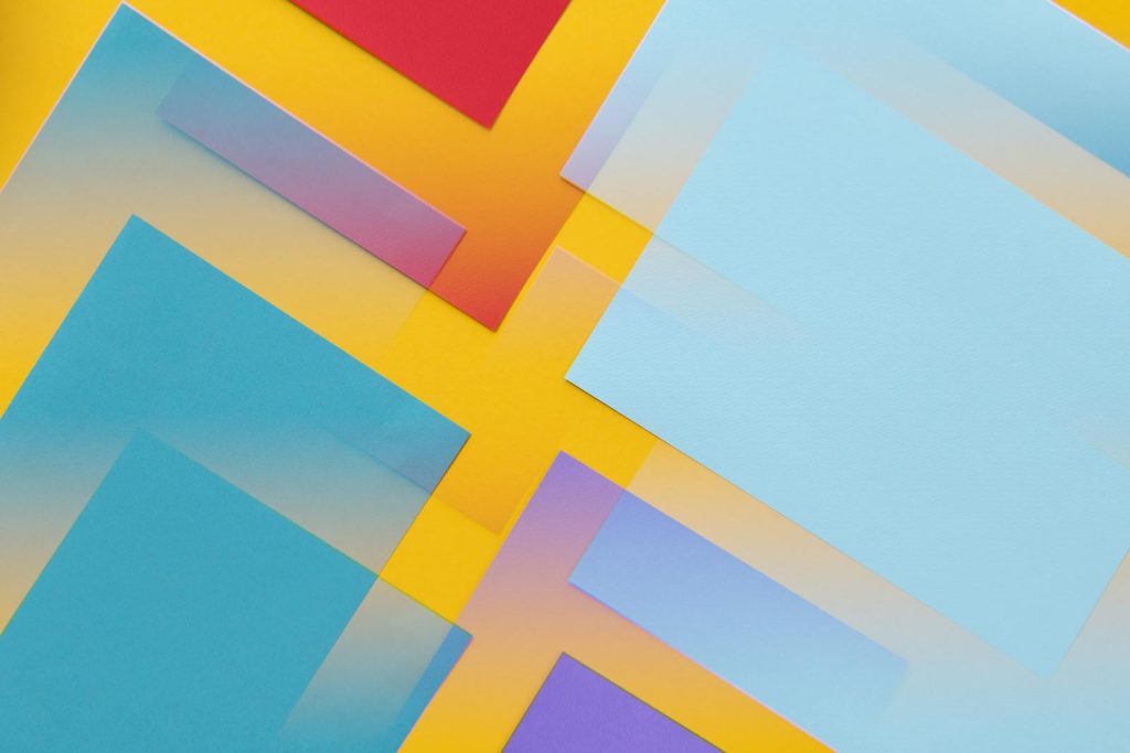 Colorful abstract geometric composition with pastel overlays on a vibrant background.